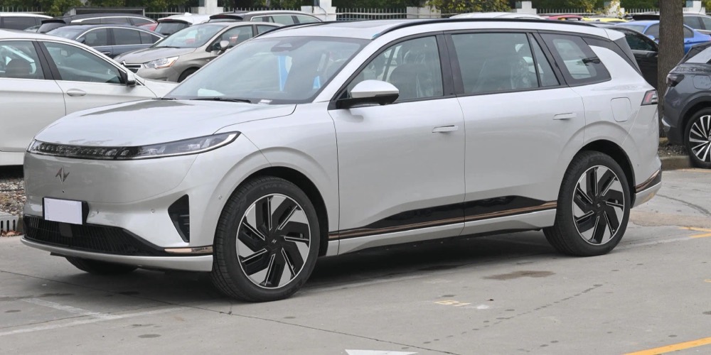 Used electric SUV parked at a dealership